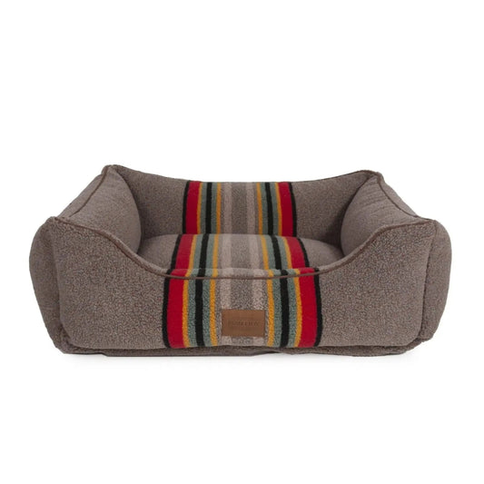 Pendleton taupe sherpa kuddler dog bed with red, yellow, and black camp stripes and raised bolster sides.