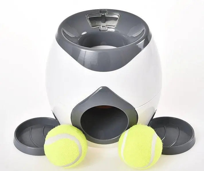 Purrfect Pet Kingdom automatic fetch machine for dogs with two yellow tennis balls and a gray and white launcher