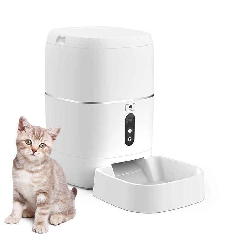 Purrfect Pet Kingdom automatic pet food dispenser with white modern design and cat next to bowl