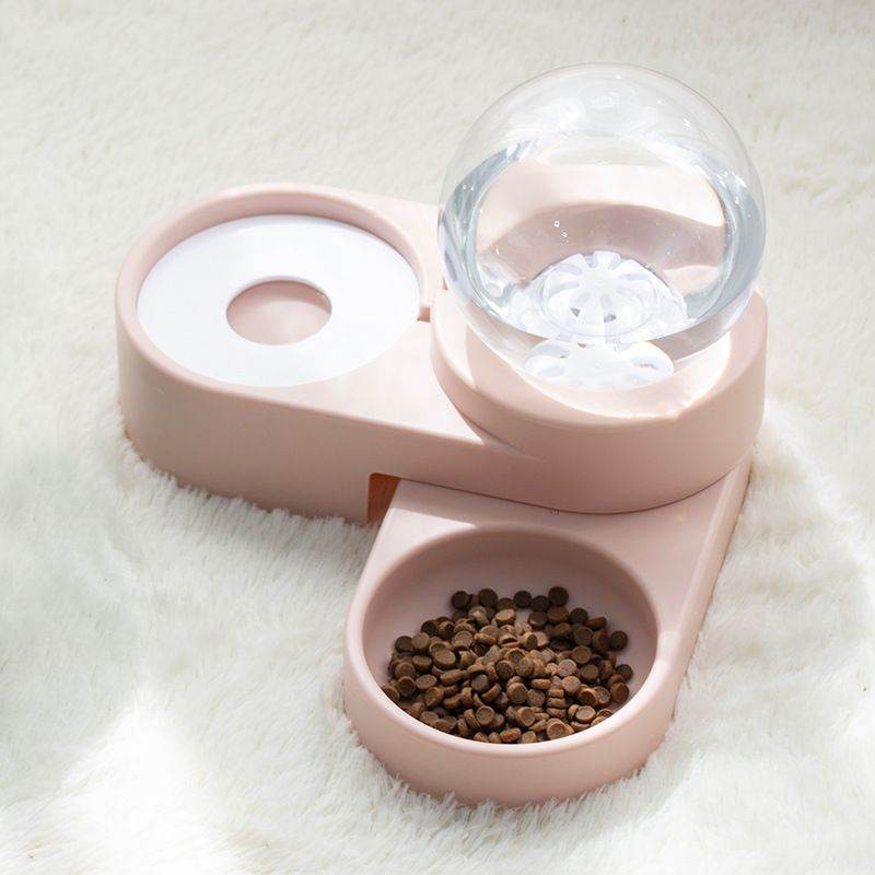 Purrfect Pet Kingdom pink automatic pet water fountain with attached dry food bowl on white surface