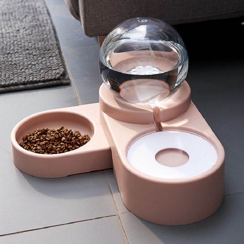 Purrfect Pet Kingdom automatic pet water fountain with integrated food bowl in pink for pets