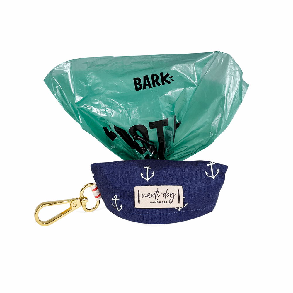 Cute pet waste bag dispenser for dogs in navy with anchor design and attached clip for easy carrying