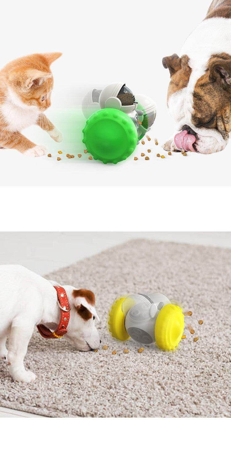 Purrfect Pet Kingdom Brain Booster Dog Toy in green and yellow being used by dogs and a curious cat
