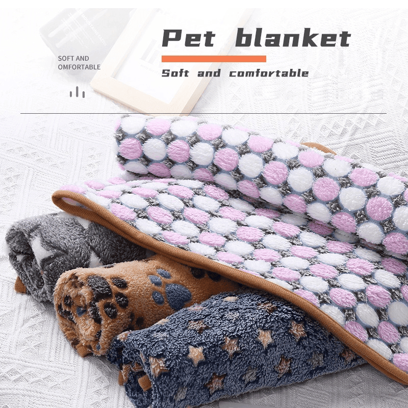 Cozy pet blanket for dogs and cats with soft plush fabric and playful paw and star designs