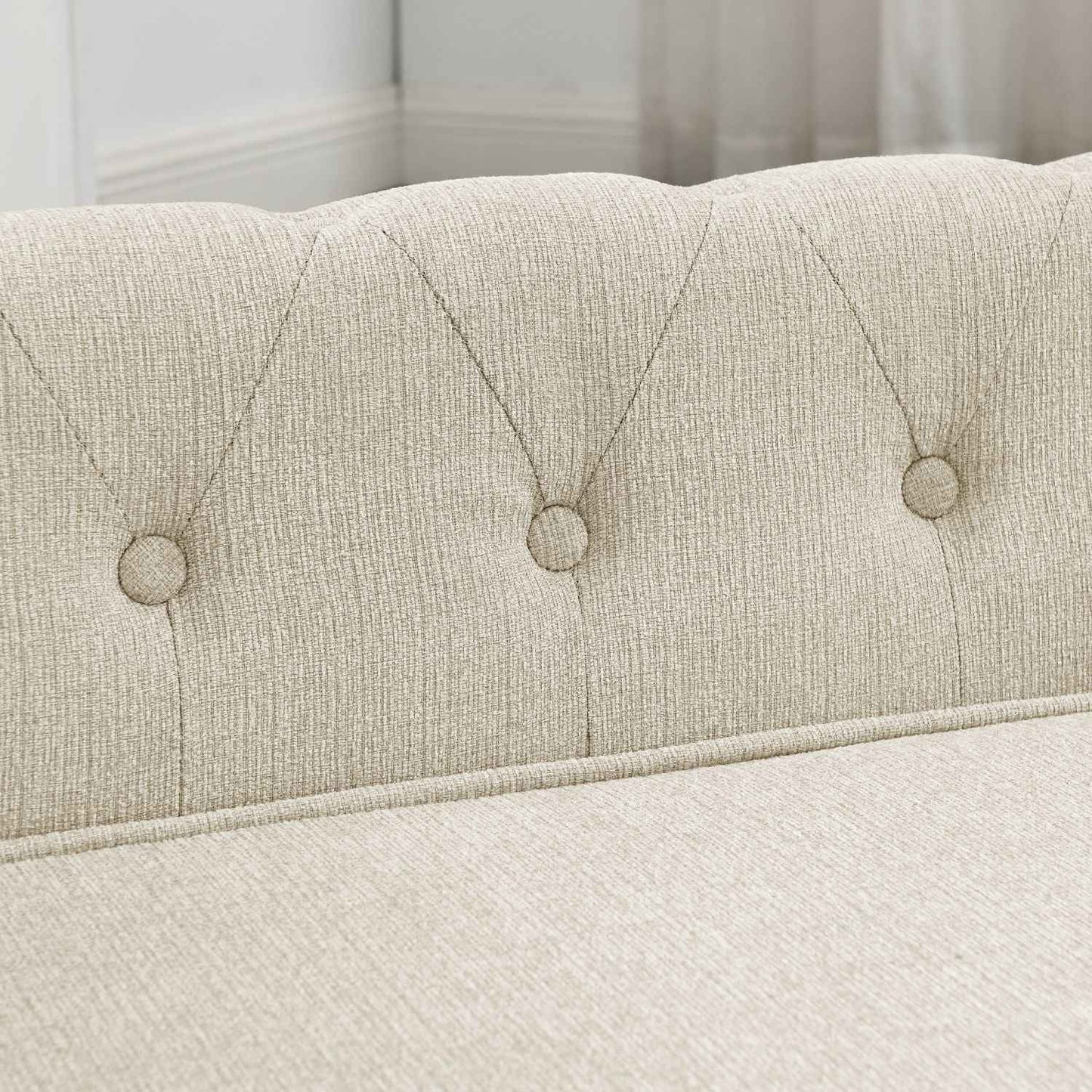Close-up of beige tufted fabric on a noble dog bed by Purrfect Pet Kingdom, showcasing soft textured upholstery