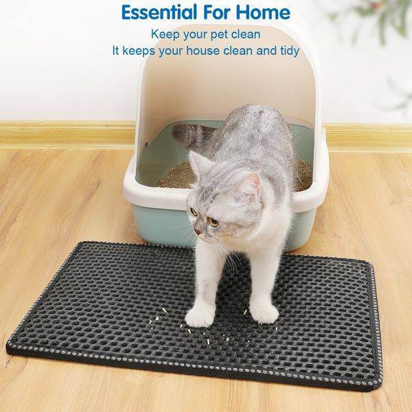Gray and white cat exiting litter box onto Purrfect Pet Kingdom cat litter scatter control mat on wooden floor