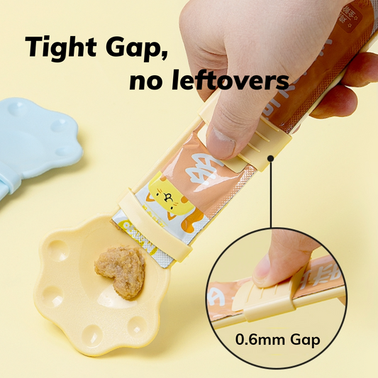 MangoPets paw shaped cat treat spoon with a tight gap design for no leftovers during treat dispensing