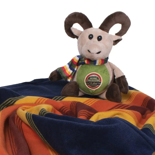 K9 Outdoors Pendleton National Park pet blanket with a plush ram toy for cozy pet comfort