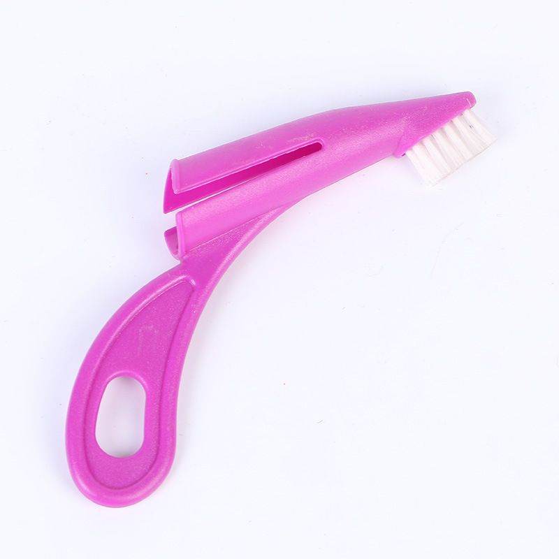 Pink pet toothbrush from Purrfect Pet Kingdom for effective pet dental care grooming supplies