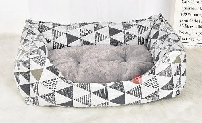 Purrfect Pet Kingdom spill-resistant cat bed with gray cushioned interior and geometric black and white pattern