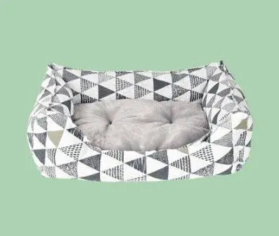 Purrfect Pet Kingdom spill-resistant cat bed with geometric black and white pattern and soft grey cushion