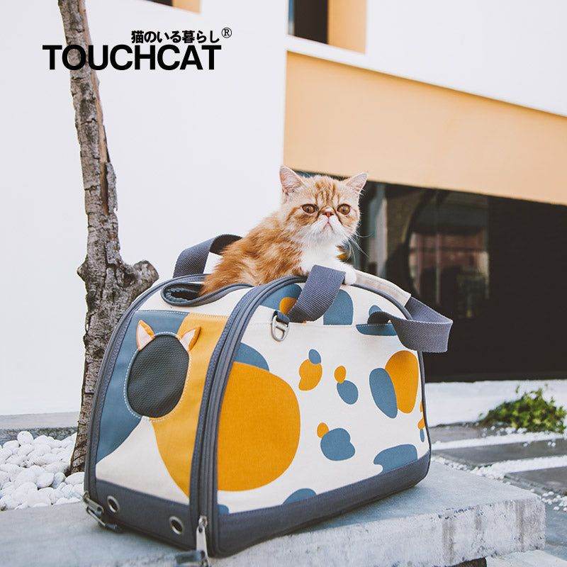 Stylish cat travel bag by Purrfect Pet Kingdom with a cute cat sitting inside outdoors