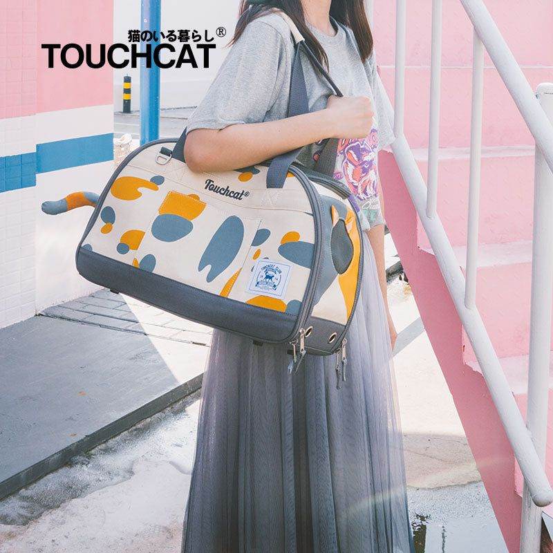Stylish cat travel bag by Purrfect Pet Kingdom carried by a woman in a casual outfit outdoors