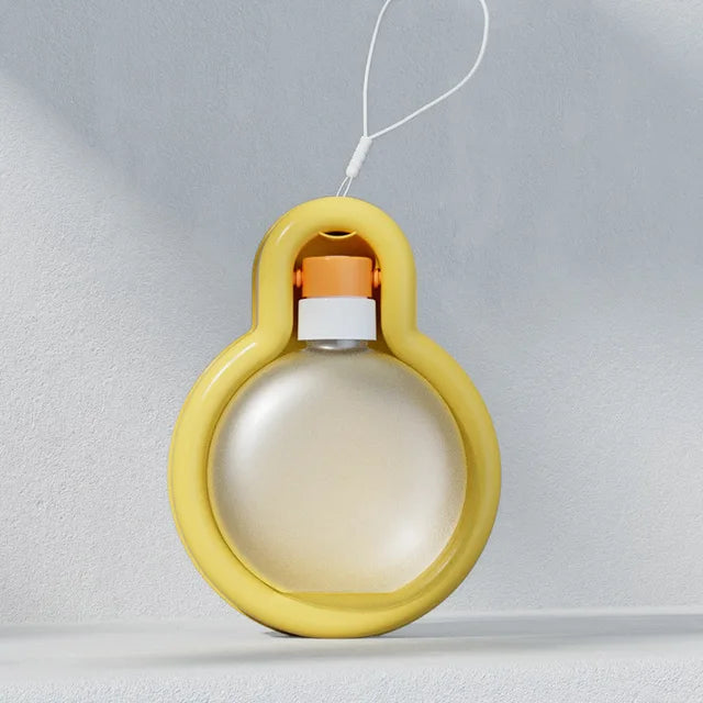 Portable travel water dispenser for cats and dogs in yellow, ideal for outdoor adventures