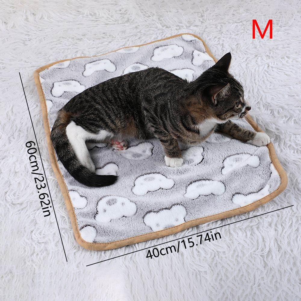 Cozy cat lying on medium warming pet pad for cats and dogs with gray cloud pattern by Purrfect Pet Kingdom