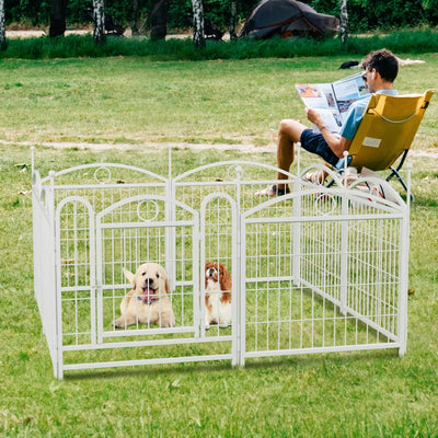 White heavy duty indoor dog enclosure by Purrfect Pet Kingdom with two dogs inside on grass