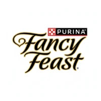 A sleek cat dining elegantly from a gold-rimmed ceramic bowl on a marble floor, soft warm lighting, luxury aesthetic.