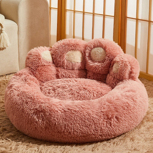 Estely dusty pink paw-shaped fleece dog bed with cream accents and a cozy, shaggy faux fur texture.