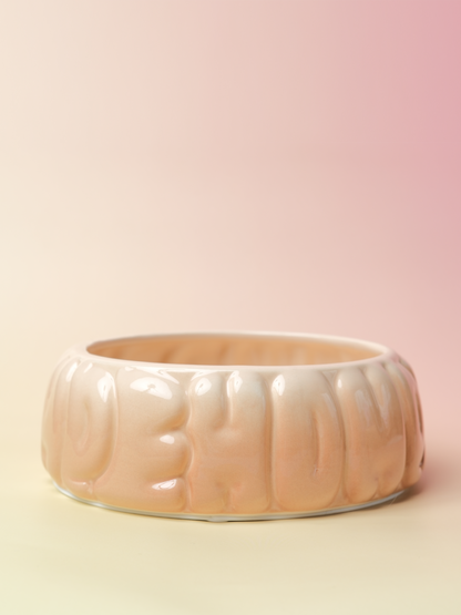 Purrfect Pet Kingdom glossy peach gradient ceramic pet bowl with a rounded bubble texture and spill-proof design.