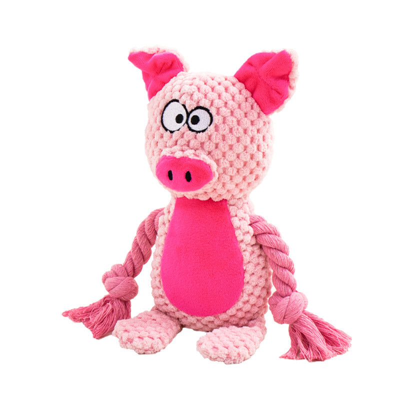 Purrfect Pet Kingdom pink pig plush dog toy with textured fabric, a bright pink belly, and knotted cotton rope arms.