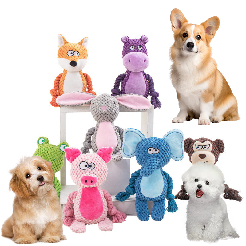 A collection of colorful animal plush and cotton rope dog toys displayed with three small dogs on a white background.