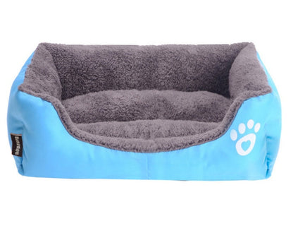 Estely blue winter pet bed with gray sherpa lining and white paw print heart logo for small dogs.
