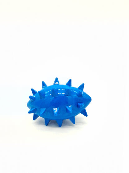 Toys N Treats Box Spikez the Ball: a glossy blue, oval-shaped rubber dog toy with firm, pointed spikes.