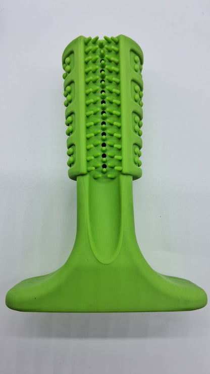 Lime green rubber dog toy with a nubbed, spiked head and wide base for upright dental cleaning and chewing.