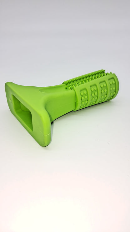 Lime green textured rubber dog chew toy 'The Grinder' with various dental nubs and a sturdy flat base.