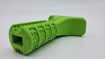 Lime green rubber Grinder dog toy by Toys N Treats Box with textured dental nubs and a T-shaped handle.