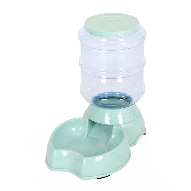 Estely mint green automatic gravity-fed pet bowl with a clear plastic reservoir and speckled plastic base.