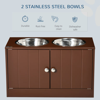 Brown wooden raised dog bowl stand with two stainless steel bowls and a storage cabinet with silver knobs.
