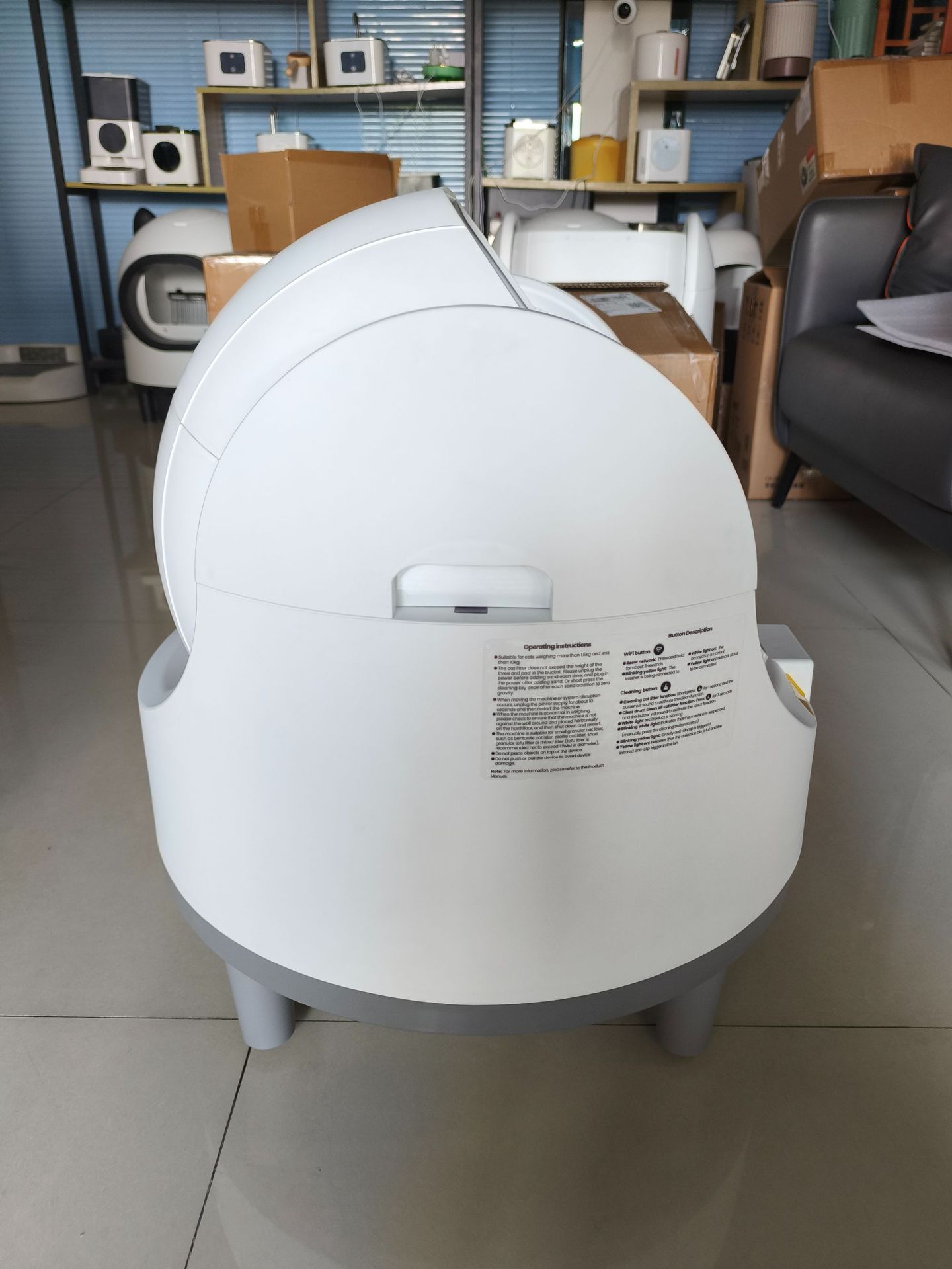 White and grey dome-shaped Purrfect Pet Kingdom smart automatic self-cleaning cat litter box on four short legs.