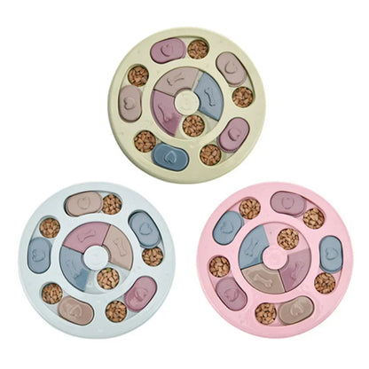 Purrfect Pet Kingdom interactive plastic puzzle slow feeders in green, blue, and pink with sliding lids and kibble.