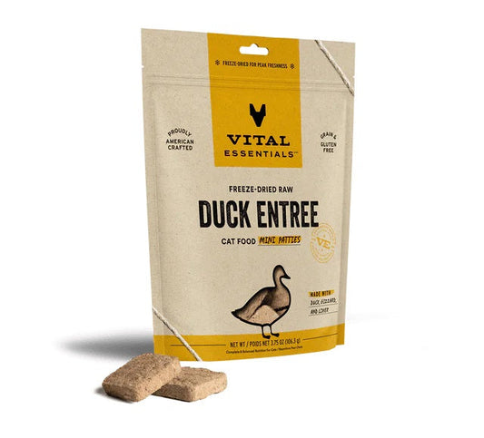 Vital Essentials Duck Mini Patties freeze-dried cat food bag with two raw patties displayed in front.