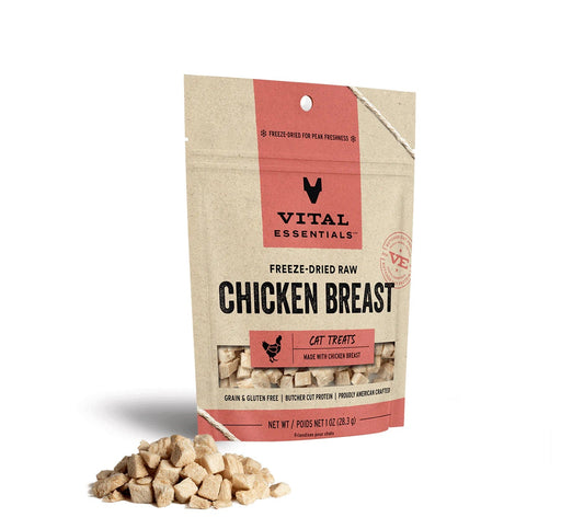 Vital Essentials freeze-dried raw chicken breast cat treats in a tan and red stand-up pouch, with treats in front.