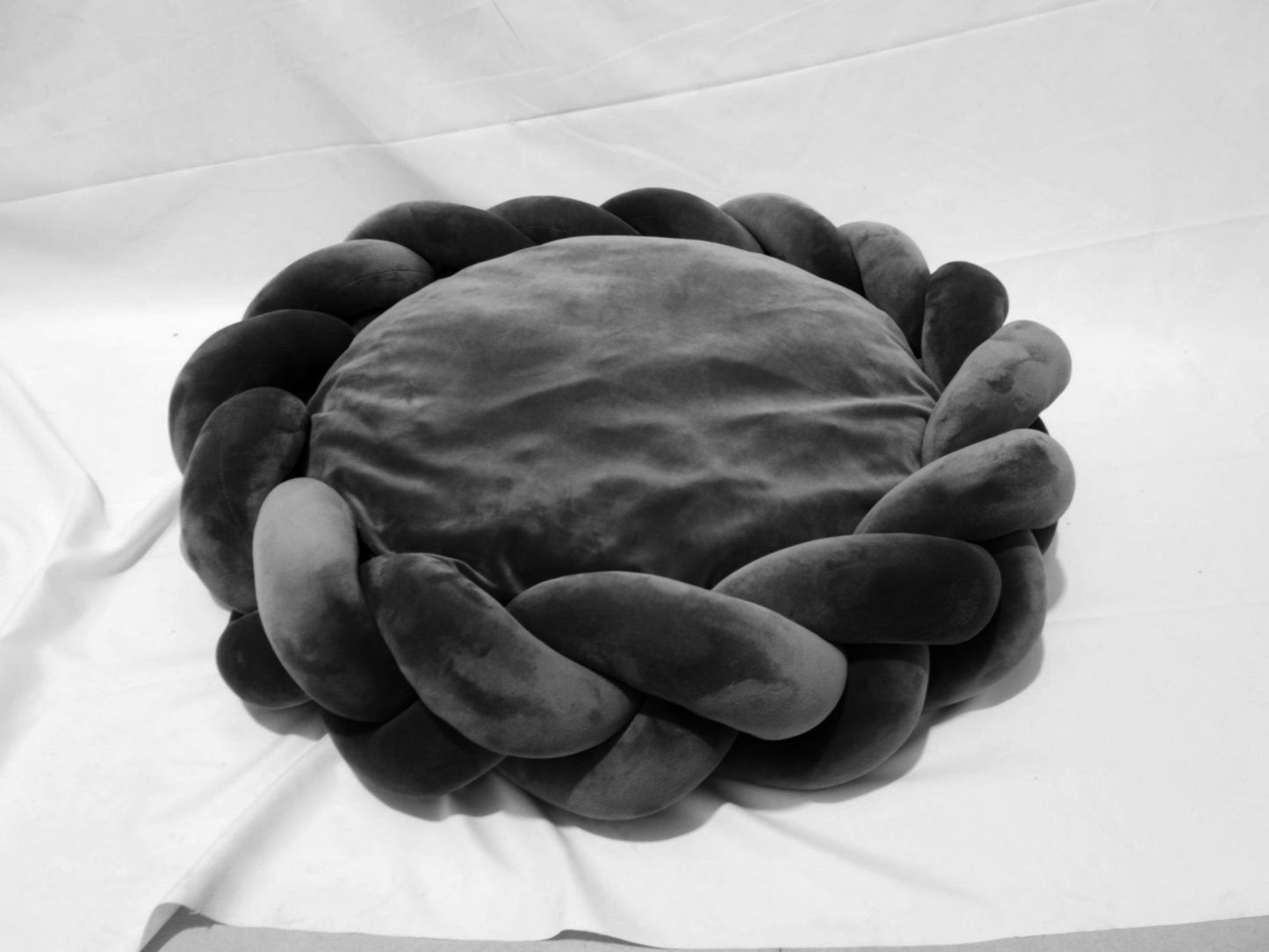 Dark gray plush velvet Purrfect Pet Kingdom Slumber Circle pet bed with a braided donut rim and soft center cushion.