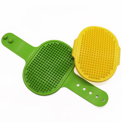 Purrfect Pet Kingdom green silicone strap brush and yellow hand brush with soft bristles for gentle pet deshedding.