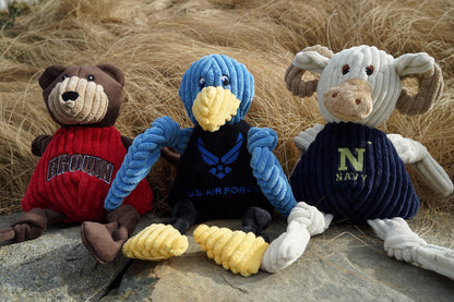 White corduroy Navy Goat dog toy with knotted rope limbs and a navy blue jersey embroidered with "NAVY".