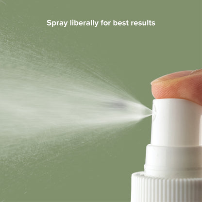 White plastic nozzle emitting a fine mist on a sage green background. Text: Spray liberally for best results.