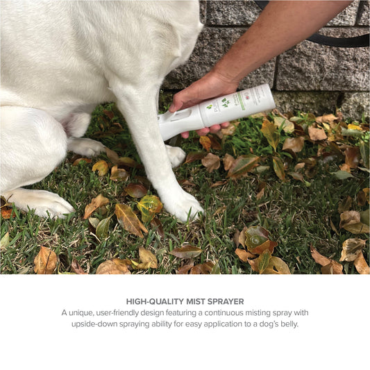 Purrfect Pet Kingdom Natural Flea and Tick Spray being applied to a white dog's leg with a white mist sprayer bottle.