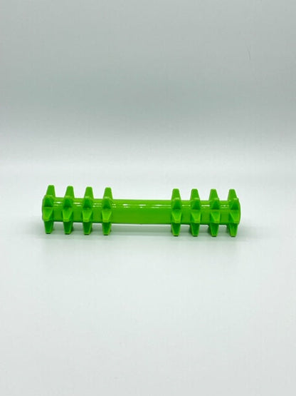Lime green rubbery dog chew toy with a smooth middle rod and two ends featuring rows of firm, pointed spikes.