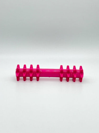 Hot pink rubber 'Double the Spikez' dog toy featuring dual-ended textured spikes for chewing and play.