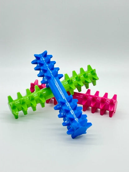Toys N Treats Box Double the Spikez: Blue, pink, and green spiked rubber dog chew toys with a textured surface.