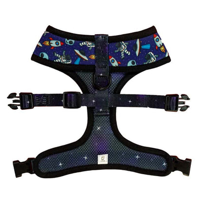 Purple space-themed reversible dog harness with astronauts and rockets, breathable mesh, and adjustable black straps.