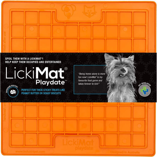 Orange LickiMat Playdate square enrichment mat with a grid pattern, featuring branding and a dog photo on the label.