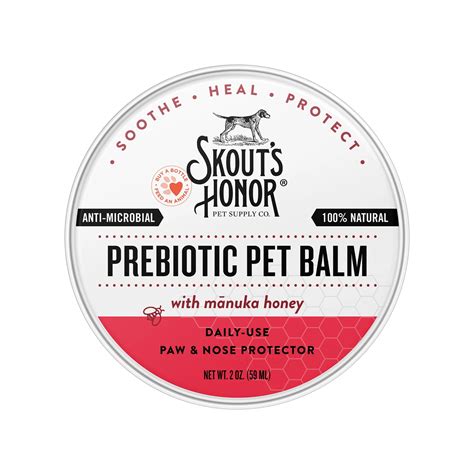 Skout's Honor 2oz prebiotic pet balm tin for dogs and cats. White and red label with dog icon and text.