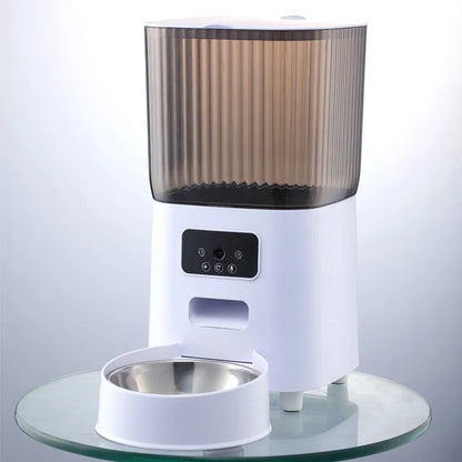 White 5L smart cat feeder with a smoky ribbed tank, dual camera control panel, and stainless steel bowl.