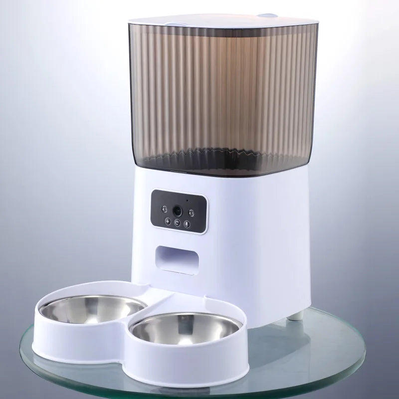 White covers4phones 5L smart feeder with smoke-gray ribbed hopper, dual camera, and two stainless steel bowls.