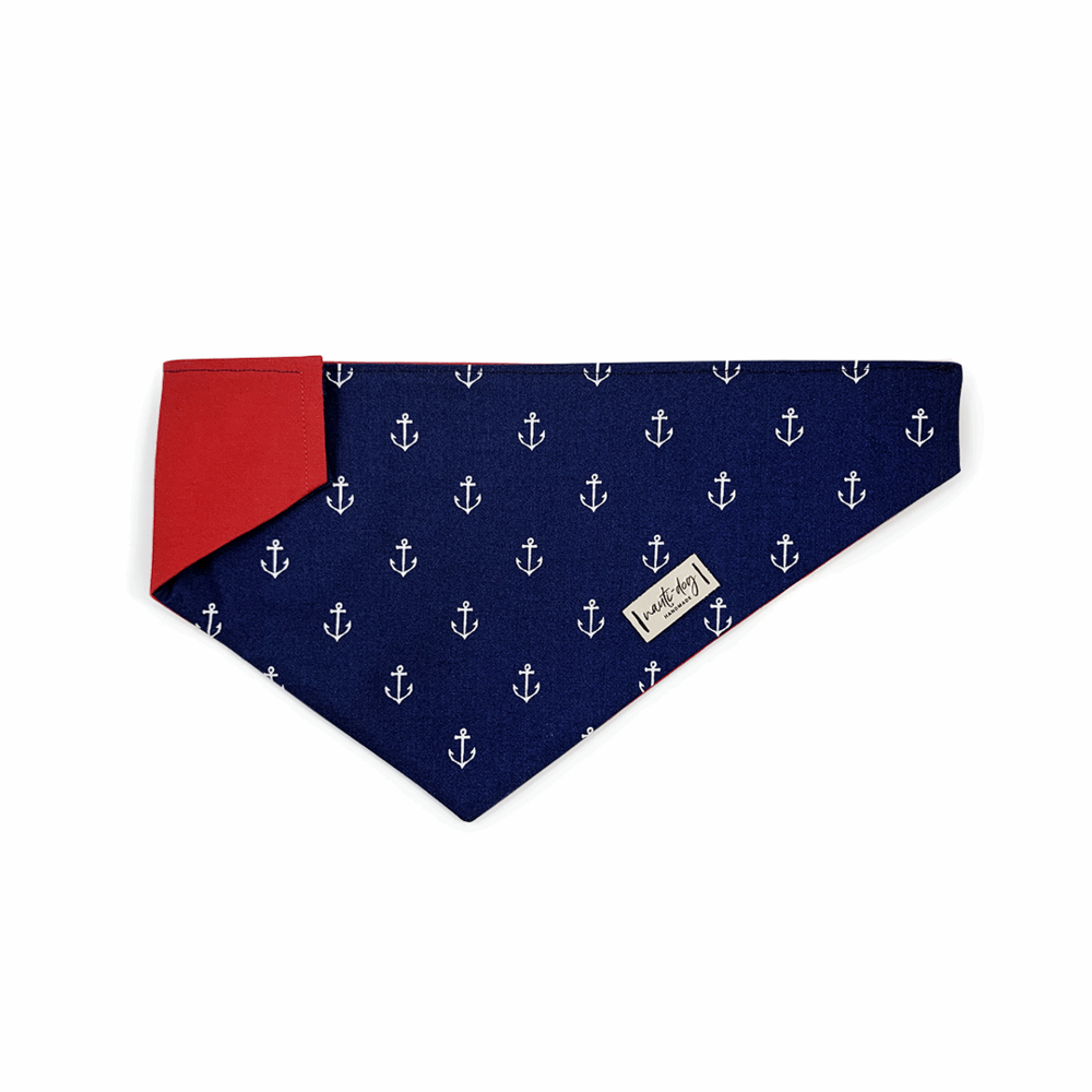 Nauti-dog Handmade anchors dog bandana over the collar in navy blue with red trim